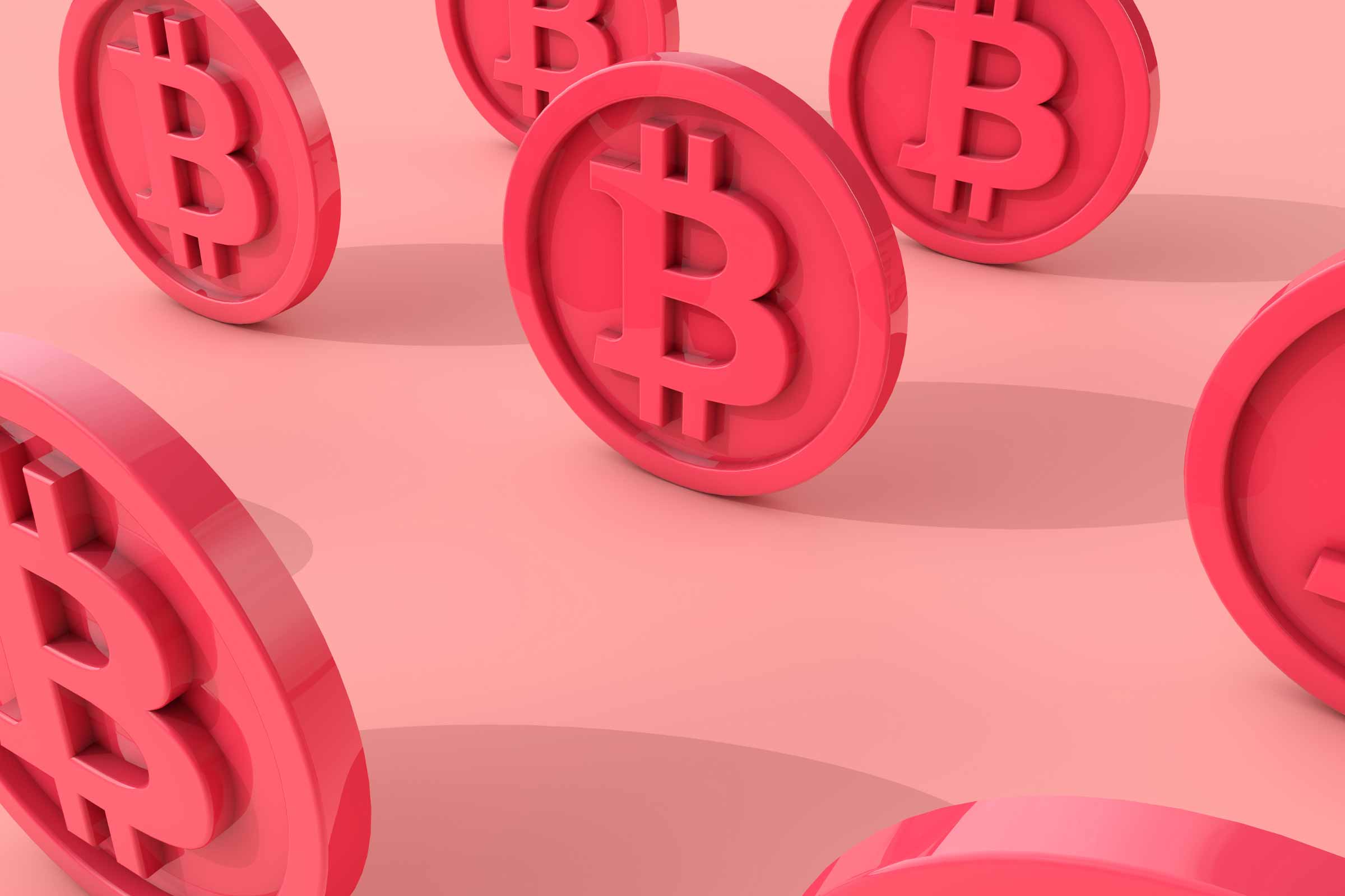 Red bitcoin coins on red background